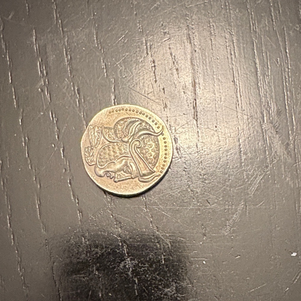 Ancient Coin with Historical Figures